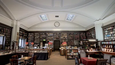 Explore the elegant and historic interior of a classic library in Manchester, England. Perfect for literature enthusiasts.